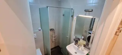 a bathroom with a sink and a glass shower at Amar5 in Belgrade