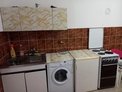 a kitchen with a washing machine and a sink at Surcin center house in Surčin