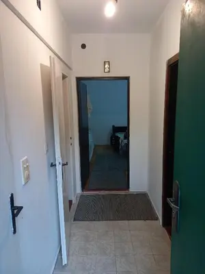 a hallway with a door leading into a room at Surcin center house in Surčin