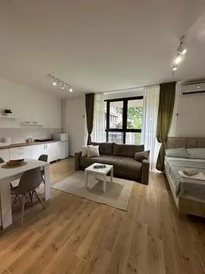 a living room with a couch and a table at BeGreat in Belgrade