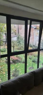 a living room window with a view of a yard at BeGreat in Belgrade