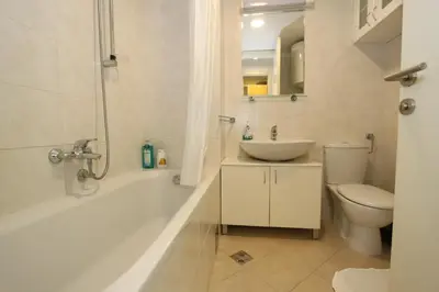 a bathroom with a tub and a sink and a toilet at Kokpit - Stan Na Dan Novi Beograd Belvil, parking 5 evra dan in Belgrade