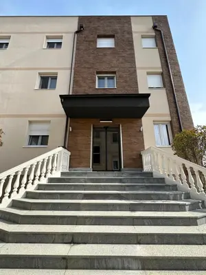 a building with stairs in front of a building at KAME HOTEL BELGRADE,\u8d1d\u5c14\u683c\u83b1\u5fb7\u51ef\u7f8e\u9152\u5e97 in Ledine