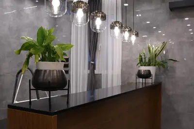 two potted plants sitting on a counter with lights at KAME HOTEL BELGRADE,\u8d1d\u5c14\u683c\u83b1\u5fb7\u51ef\u7f8e\u9152\u5e97 in Ledine