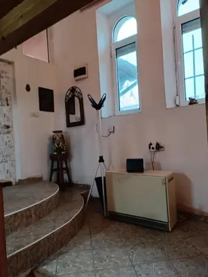 a room with stairs and a camera on a tripod at Maravilja in Filmski Grad