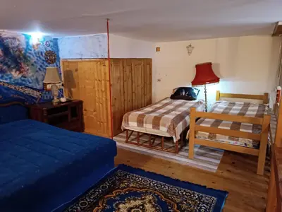 a living room with two beds and a couch at Maravilja in Filmski Grad