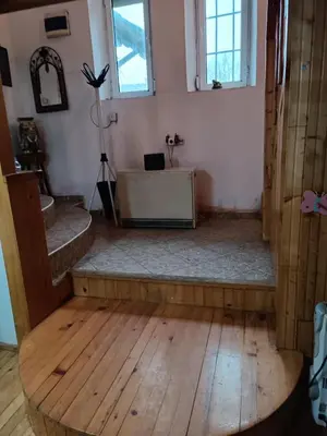 a room with a table in the middle of a room at Maravilja in Filmski Grad