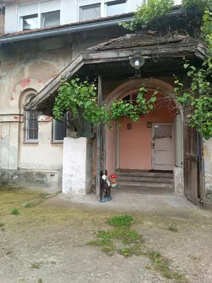 a dog standing in front of a house at Maravilja in Filmski Grad