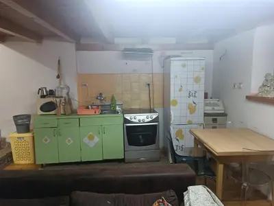a small kitchen with a stove and a refrigerator at Maravilja in Filmski Grad