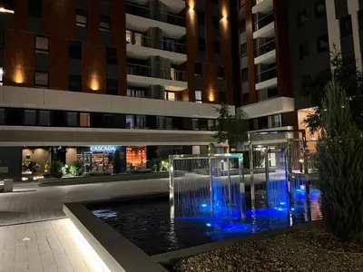 a water fountain in front of a building at THE FIVE-New Belgrade Apartment in Belgrade