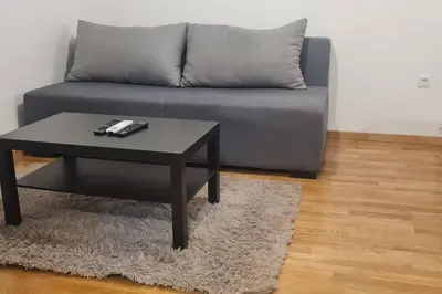 a living room with a couch and a coffee table at Amar 4 in Zemun