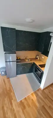 a kitchen with a sink and a counter top at Amar 4 in Zemun