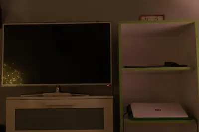 a large flat screen tv sitting on top of a cabinet at Apartment Mina in Belgrade