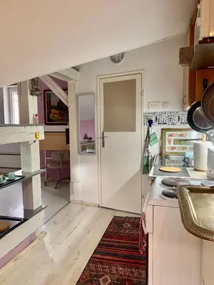 a kitchen with a white door and a counter top at Apartment Mina in Belgrade