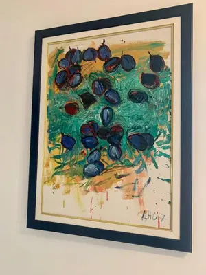 a painting of olives hanging on a wall at Apartment Mina in Belgrade