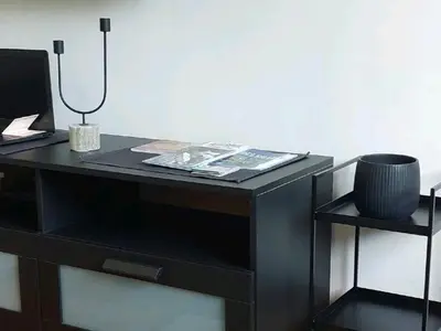 a black desk with a lamp on top of it at Apartman Elena Dedinje in Belgrade