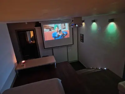 a living room with a flat screen tv on the wall at Jacuzzi Vaki Apartment in Belgrade