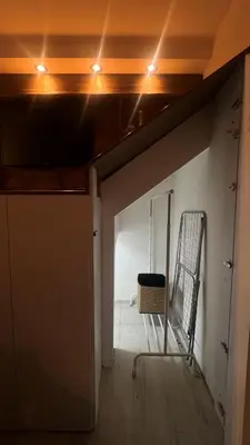 a room with a door and a chair in it at Sanska 25 in Dušanovac (historical)