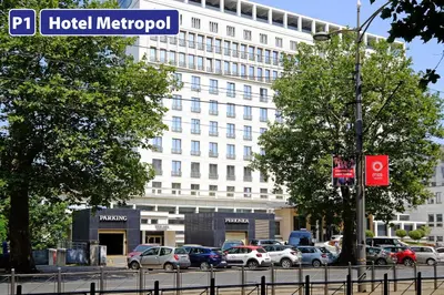 a street sign in front of a hotel metropolitan at Vintage Dream Apartment in Belgrade