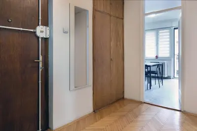 an empty room with a door and a table at Vintage Dream Apartment in Belgrade