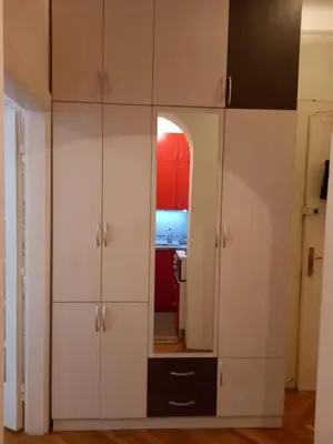 a room with white cabinets and a mirror at Sofija 1 in Vračar (historical)