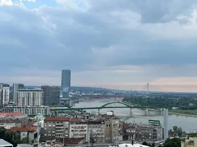 a view of a city with a river and a bridge at Central Sky View Apartment in Belgrade