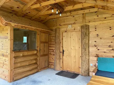 a wooden room with a door in a cabin at Vikendica Milošević in Arandjelovac