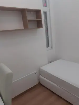 a white room with a bed and a window at Beograd /Slavija - fontana 70 m2 in Sajmište
