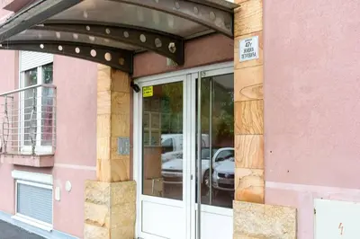 awning over a glass door of a building at Royalux Zemun Residences in Belgrade
