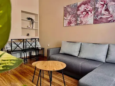 a living room with a couch and a table at Stefan Suite Belgrade Center Apartment in Belgrade