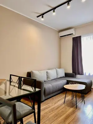 a living room with a couch and a table at Stefan Suite Belgrade Center Apartment in Belgrade