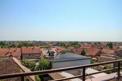 a view of a city from a balcony at Apartman San in Ruma