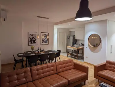a living room with a couch and a table at Luxury Belgrade Waterfront top floor Apt with an amazing view in Belgrade