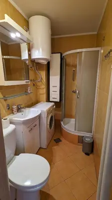 a bathroom with a toilet sink and a shower at Temple saint sava in Dušanovac (historical)