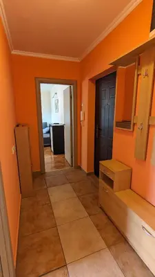 a room with orange walls and a hallway at Temple saint sava in Dušanovac (historical)