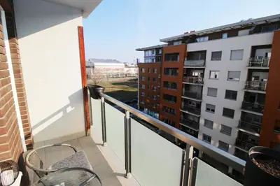 a balcony with a view of two buildings at Apartman Bizmark in Novi Beograd