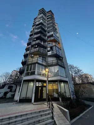 a tall building with a light at the top of it at Squeeze The Day in Belgrade