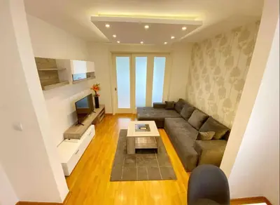 a living room with a couch and a television at Neven in Novi Beograd