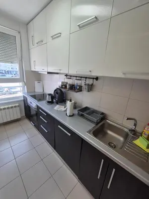 a kitchen with a sink and a counter top at Neven in Novi Beograd