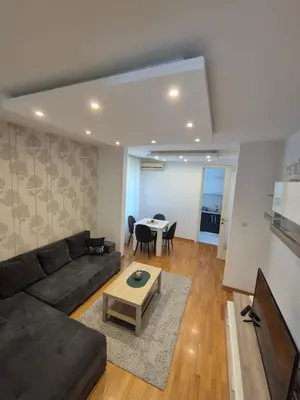 a living room with a couch and a table at Neven in Novi Beograd