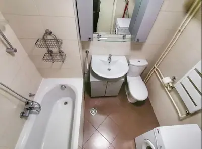 a bathroom with a sink and a toilet and a tub at Neven in Novi Beograd