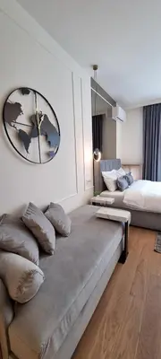 a room with two beds and a couch in it at Beograd na vodi - BW Terra Exclusive in Belgrade