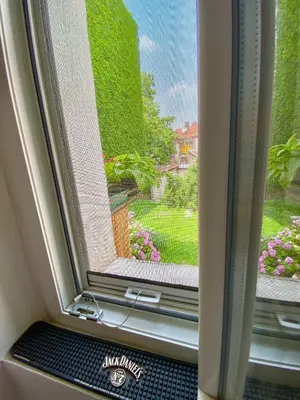 a window with a view of a garden at Square 29 in Belgrade