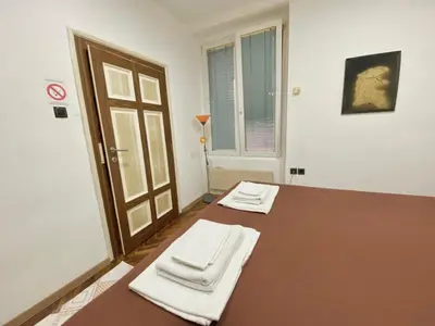 a room with a table with two white napkins on it at Square 29 in Belgrade