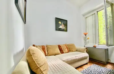 a living room with a couch and a window at Square 29 in Belgrade