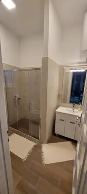 a bathroom with a shower and a sink at Bohemian in Belgrade