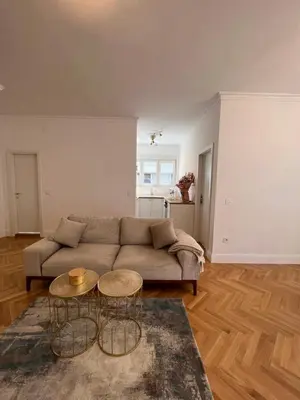a living room with a couch and two tables at Old Town Gate in Belgrade