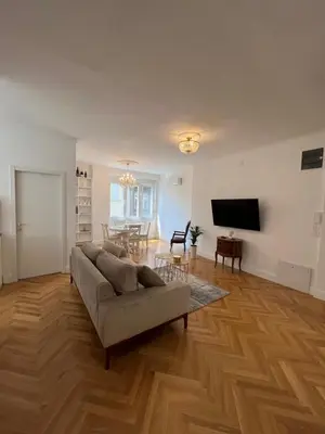 a living room with a couch and a television at Old Town Gate in Belgrade
