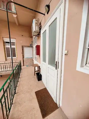 a hallway with a door and a balcony at Republic Square Studio in Belgrade