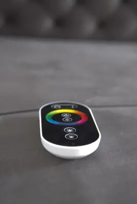 a phone with a rainbow on it sitting on a table at Lux Flat Center in Belgrade